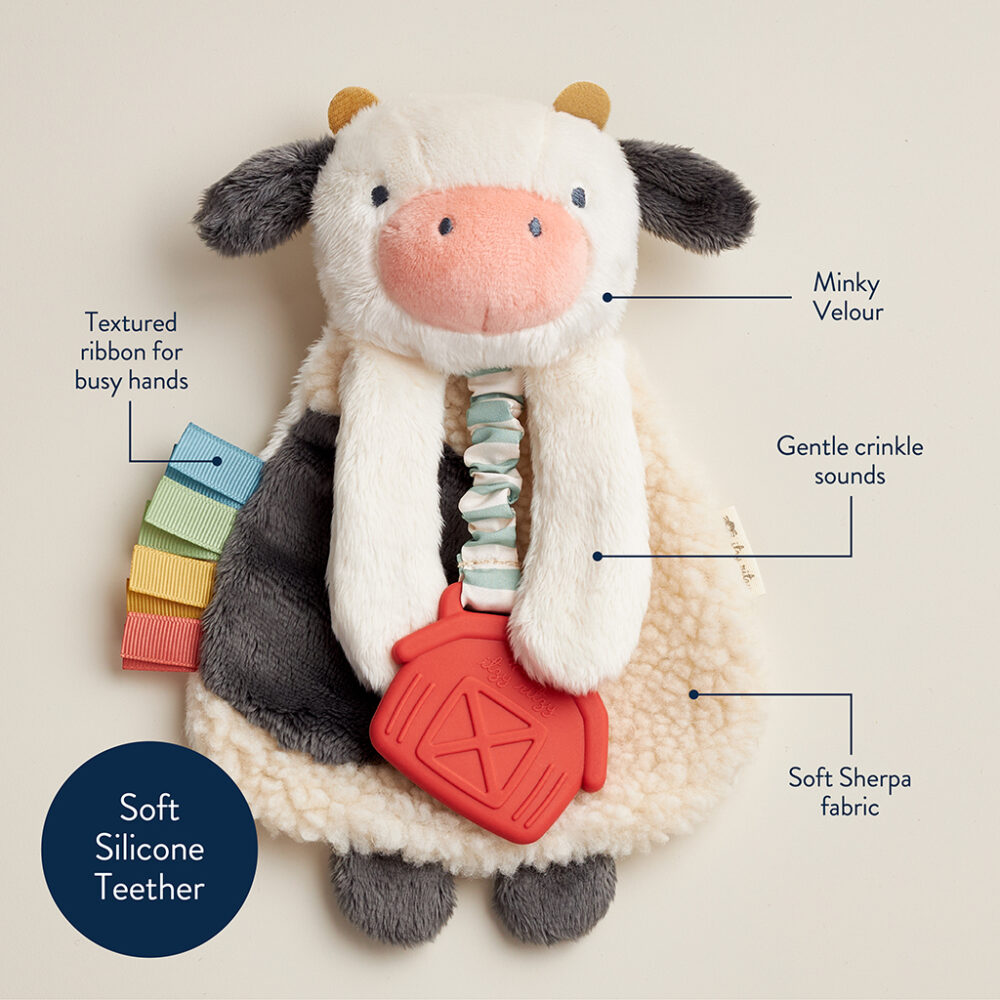 A plush cow with a soft silicone teether, textured ribbon, minky velour, and soft Sherpa fabric. The toy makes gentle crinkle sounds.