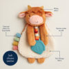 Plush cow toy with textured ribbon, a silicone teether, soft Sherpa fabric, minky velour, and gentle crinkle sounds.