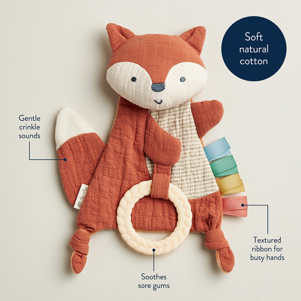 A cotton fox-shaped baby toy with a ring for teething, textured ribbon, and crinkly sound features. The material is advertised as soft natural cotton.