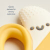 Close-up of the Itzy Ritzy Chew Crew Silicone Teether with Handles, showcasing its gentle textures and soft colors along with a smiley face, accompanied by text: "Gentle textures for sensory exploration.