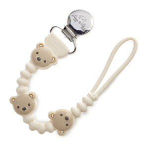 The Itzy Ritzy Sweetie Strap Plus Bear Silicone Pacifier Clip is a baby pacifier clip adorned with teddy bear designs, featuring a loop at one end for attachment and a metal clip at the other end for fastening to clothing.