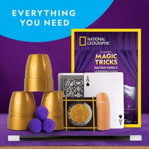 A National Geographic Magic Set 5 Tricks Perform Magic Kit Wand Card Cup Balls STEM Educational NatGeo NGEO featuring cups, balls, cards, a magic wand, a thumb prop, and a National Geographic instruction guide against a purple backdrop with text saying "EVERYTHING YOU NEED.