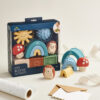 A set of colorful Itzy Ritzy Sensory Blocks 10-Piece Set featuring various shapes and textures, including a hedgehog and mushrooms, displayed with packaging on a neutral background.