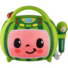 A green and pink toy karaoke machine with a smiling face on the front and an attached green microphone. The machine has a digital clock display and various control buttons.