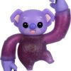 A purple, koala-like toy figure with black eyes and extended arms, posed with one arm flexed upward and the other curved downward.