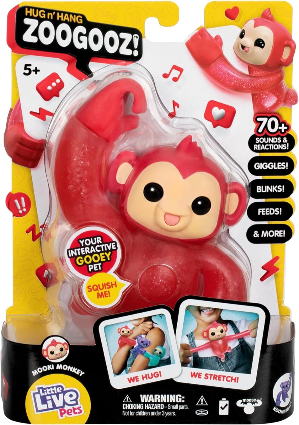 A toy package containing a 'Zoogooz' interactive monkey named Mooki. The toy claims to giggle, blink, feed, and more with over 70+ sounds and reactions. Suitable for ages 5 and up.