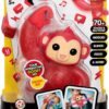 A toy package containing a 'Zoogooz' interactive monkey named Mooki. The toy claims to giggle, blink, feed, and more with over 70+ sounds and reactions. Suitable for ages 5 and up.