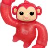 Red toy monkey with arm raised, large black eyes, and a small smile.