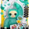 A teal-colored interactive toy sloth named "Gropey" with limbs that can hug and stretch, in its packaging. The product promises over 70 sounds and reactions and is intended for ages 5 and up.