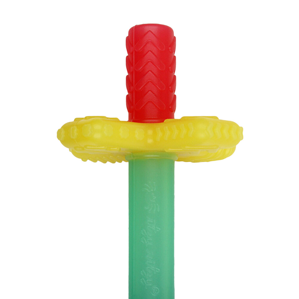 A close-up of a colorful toy sword with a red handle, yellow guard, and green blade.