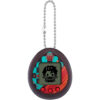 The Tamagotchi Nano x Demon Slayer - Dance of The Fire God is a digital pet device with a keychain, featuring a pixelated character on its screen. It has a patterned frame with buttons beneath the display.