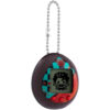 The Tamagotchi Nano x Demon Slayer - Dance of The Fire God is a digital pet device featuring a small screen with a pixelated character displayed on it. It has a black casing adorned with colorful designs and includes a chain for easy attachment.