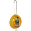 The Tamagotchi Nano x Jurassic Park 30th Anniversary - Dinosaur Amber is a yellow, oval-shaped digital pet device featuring a keychain and red buttons that displays a pixelated dinosaur on its screen.