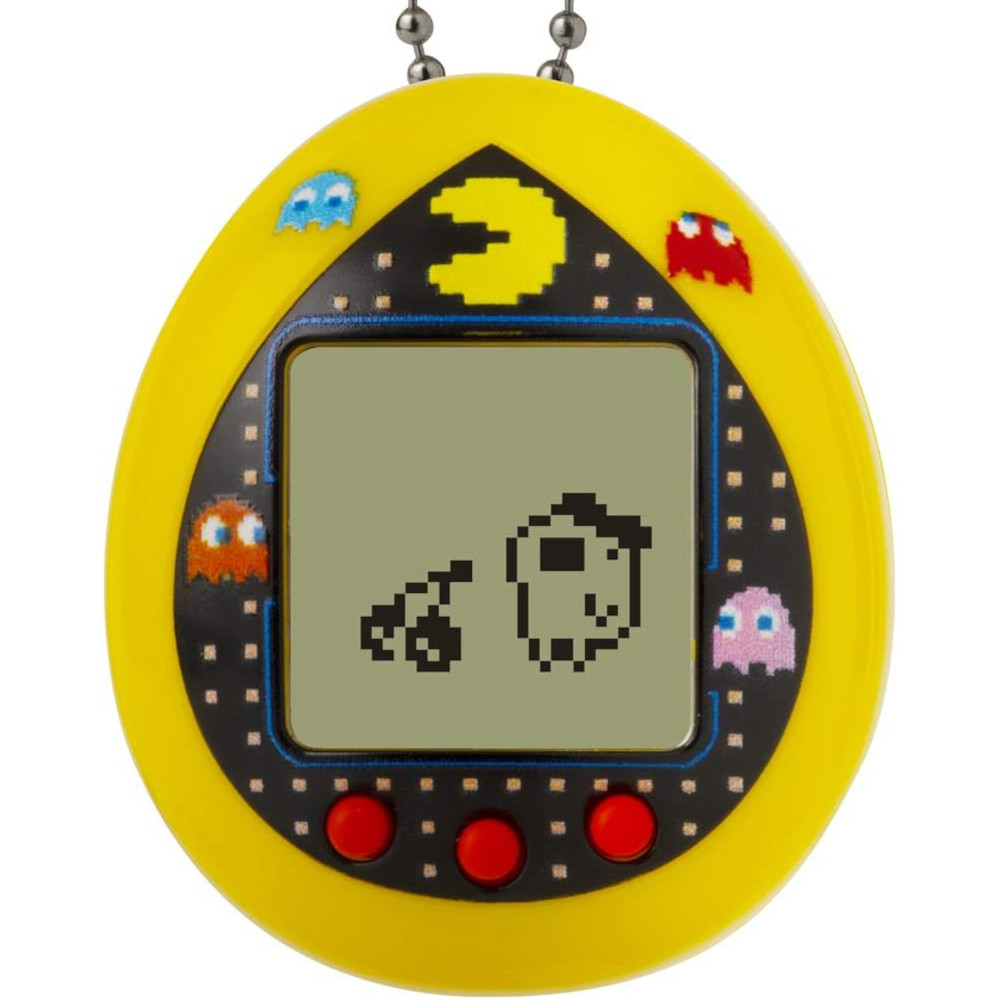 A yellow, egg-shaped virtual pet device with a screen showing a pixelated character and a cherry. The device has three red buttons at the bottom and is decorated with Pac-Man and ghost characters.