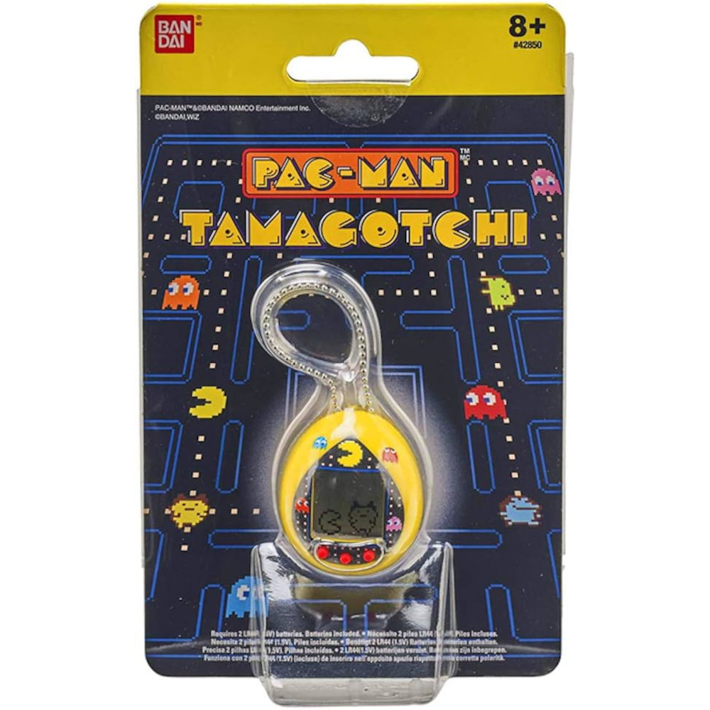 A packaged PAC-MAN Tamagotchi by Bandai for ages 8 and up. The device is yellow with a keychain, featuring a digital screen. The background showcases the PAC-MAN game maze with ghosts.