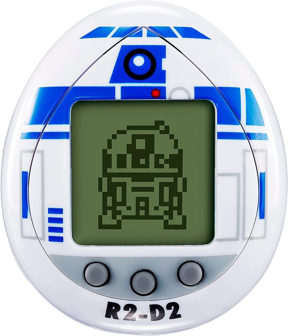 An electronic handheld game featuring a design resembling R2-D2 from Star Wars, with an LCD screen displaying a pixelated image of R2-D2 is the Tamagotchi Nano x Star Wars - R2-D2 Hologram.