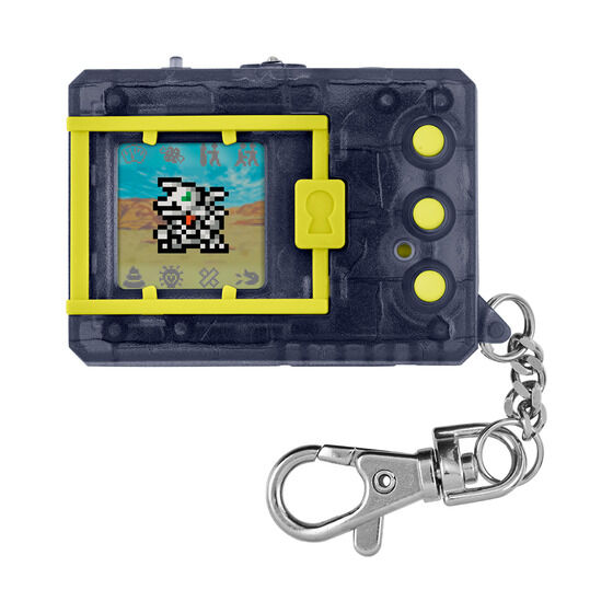 A dark gray handheld digital device with a small screen displaying a pixelated character, featuring three buttons on the side and a keychain attachment.