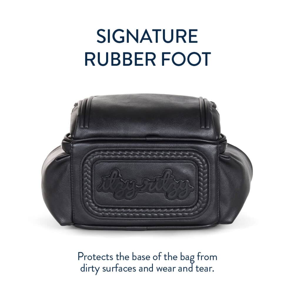 A black bag with a detailed rubber foot labeled "Itzy Ritzy" is shown. Text above reads "SIGNATURE RUBBER FOOT," with a caption below stating it protects the base from dirt and wear and tear.