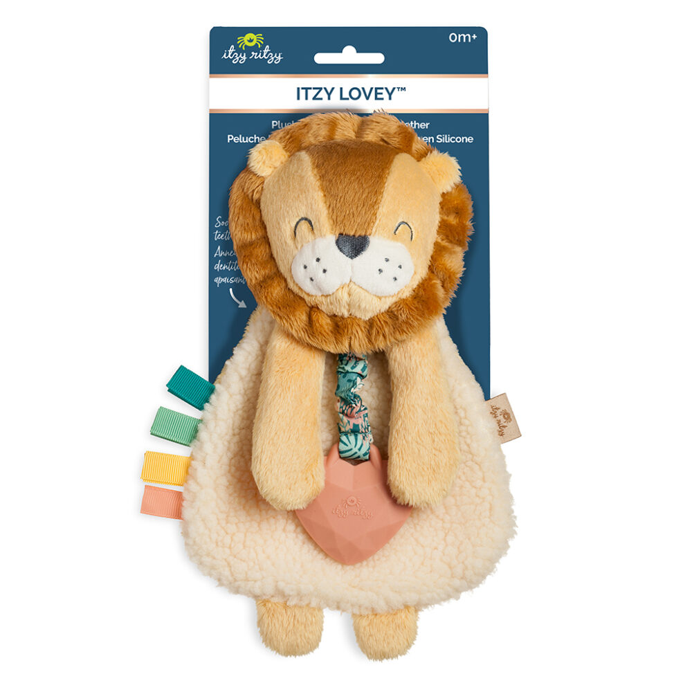 A plush lion toy for infants with a fluffy mane, colorful fabric tags on the side, and a heart-shaped silicone teether attached, packaged on a blue cardboard backer.