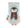 A plush penguin toy with a textured teether, colorful tags, and a red and white striped scarf. The toy is packaged with a label on top marked "Itzy Lovey.