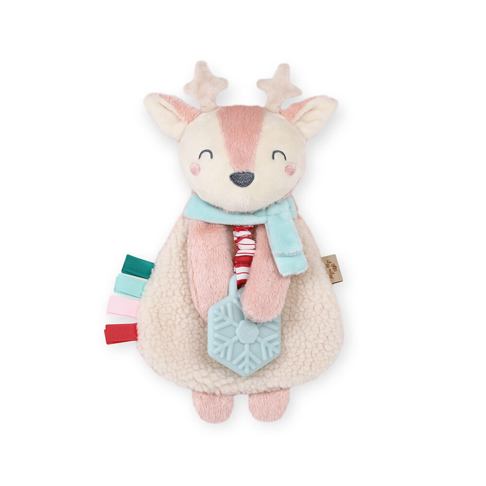 A plush reindeer toy with white and pink fur, a light blue scarf, and a snowflake-shaped teething attachment.