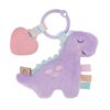 A purple dinosaur baby toy with a heart-shaped teether and colorful ribbons, isolated on a white background.