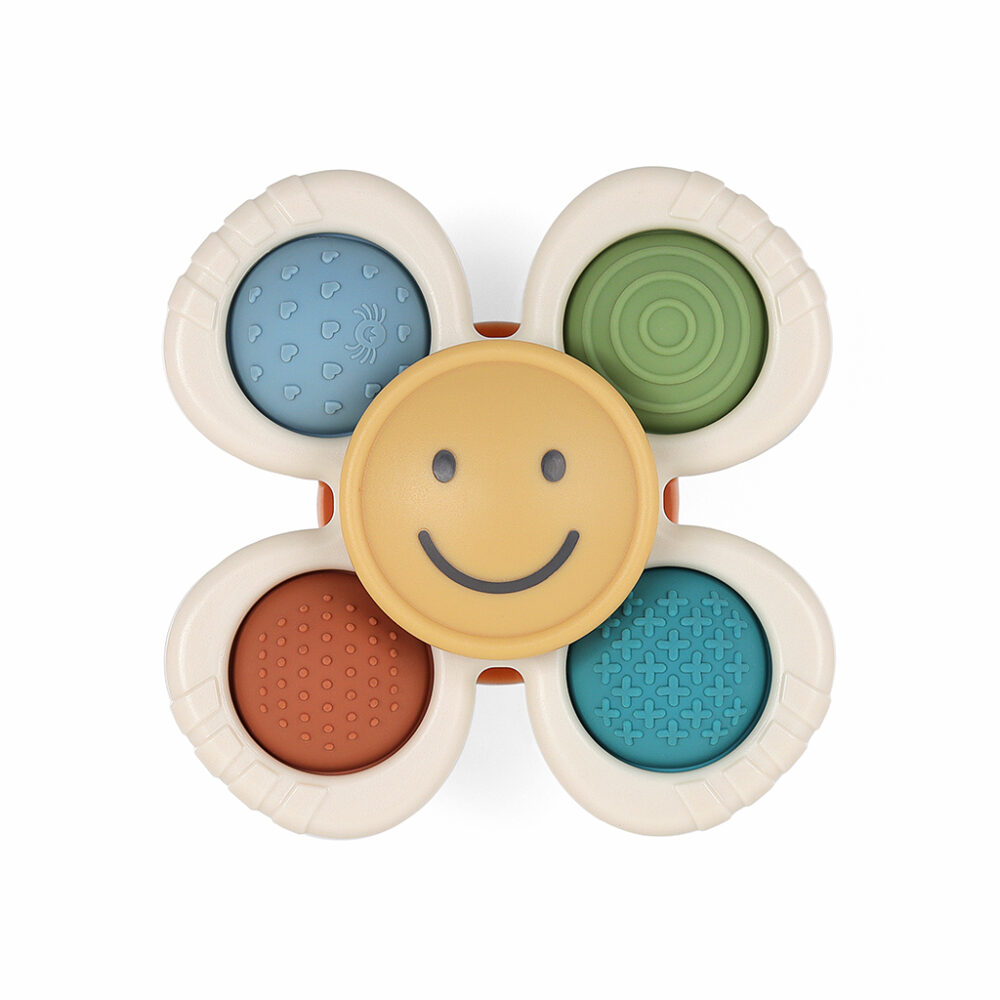 A sensory toy in the shape of a flower with five rounded petals, each featuring different textures and colors. The center is yellow with a smiling face.