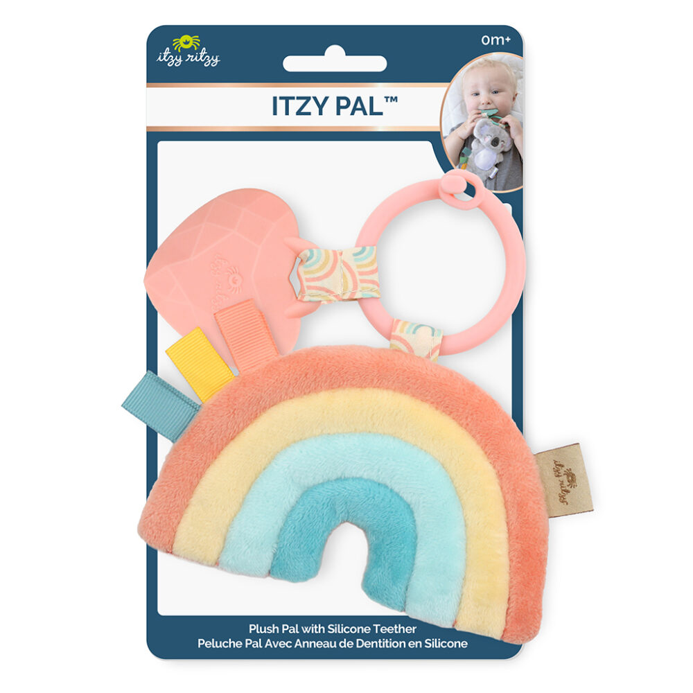 Packaged baby teething toy featuring a plush rainbow with a silicone teether and colorful tags, branded as "Itzy Ritzy - Itzy Pal - Plush Pal Infant Toy with Silicone Teether," displayed in a retail hanging card.