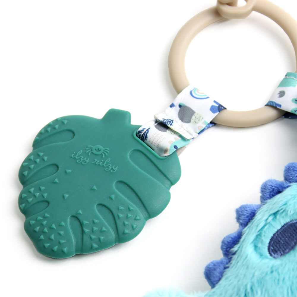 A teal Itzy Ritzy - Itzy Pal - Plush Pal Infant Toy with Silicone Teether shaped like a mitten, attached to a patterned fabric strap and a plastic ring, isolated on a white background.