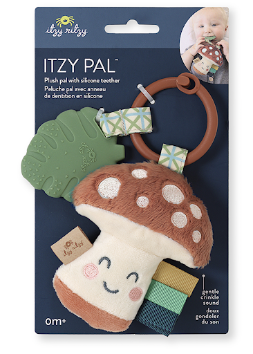 Packaged Itzy Ritzy - Itzy Pal - Plush Pal infant toy shaped like a smiling mushroom with attached silicone teether and fabric tags, displayed on a blue card with an image of a baby.