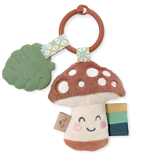 A Itzy Ritzy - Itzy Pal - Plush Pal Infant Toy with Silicone Teether featuring a smiling mushroom plush with a teething leaf and colorful rings attached to a wooden ring.