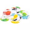 A stack of circular coasters featuring the vibrant and playful designs from the Pressman Color Smash Family Card Game, showcasing splashes of green, blue, red, yellow, and black against a crisp white background.